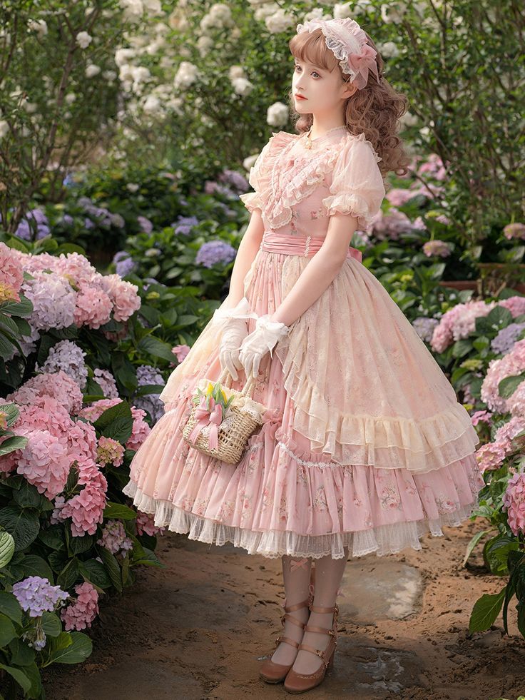 a young woman wearing a pink floral dress stands on a path in a garden. the dress is in a lolita style, with puffed sleeves and a full skirt. she is carrying a wicker basket and is looking away from the camera. the garden is filled with pink and purple flowers, and the lighting is soft and diffused.