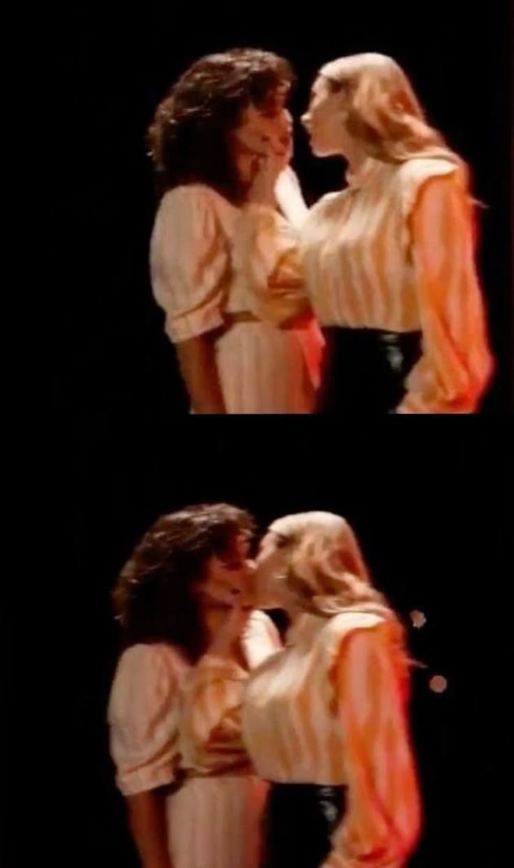the image shows two pairs of women in different shots, seemingly in moments of affection or romance. in both shots, one woman is blonde, and the other is brunette. they appear to be kissing or in close proximity, suggesting an intimate relationship. both women are wearing dresses. the scene looks like it could be from a play or performance given the lighting and setting.