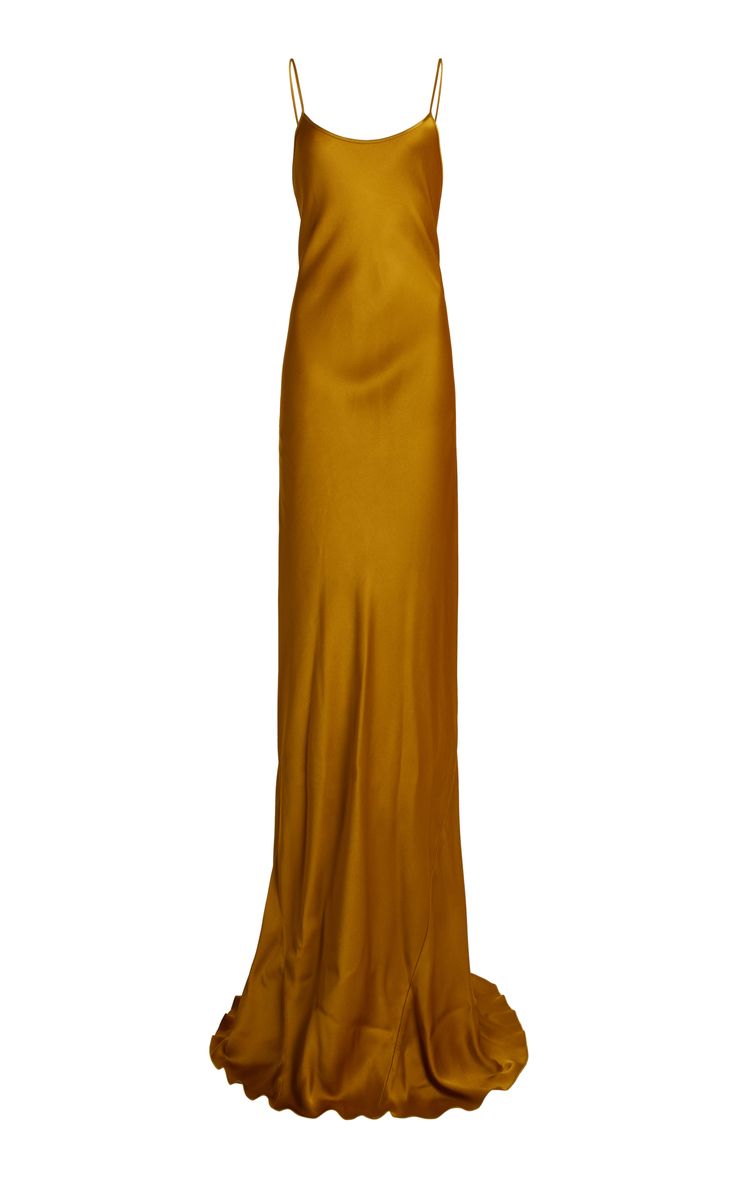 a beautiful gold silk dress with spaghetti straps and a flowing, floorlength silhouette. the dress is simple and elegant, perfect for a formal occasion.