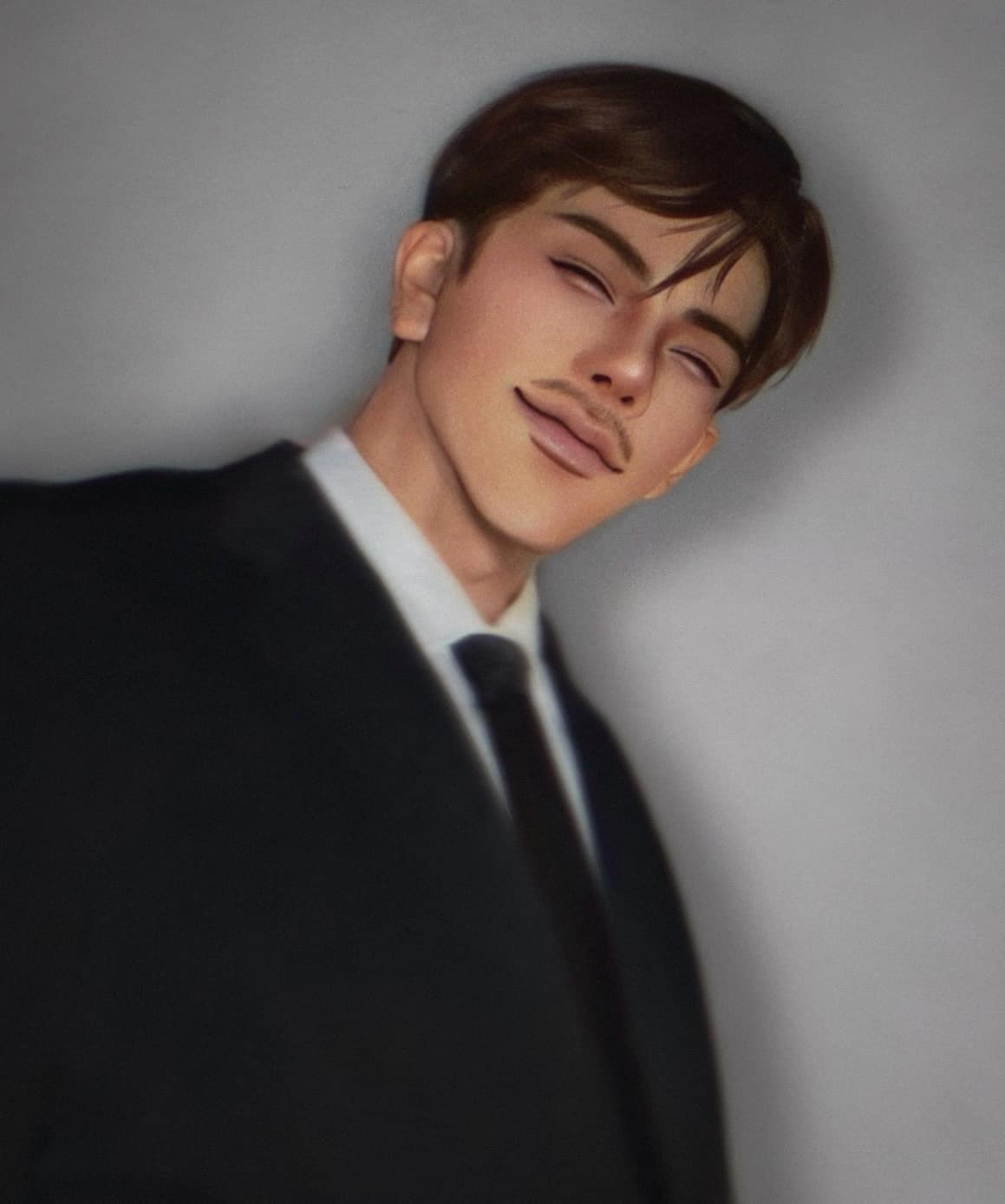 a portrait of a young man in a suit. he is looking directly at the camera and smiling slightly. he is wearing a black suit, a white shirt, and a black tie. the background is a plain gray color.