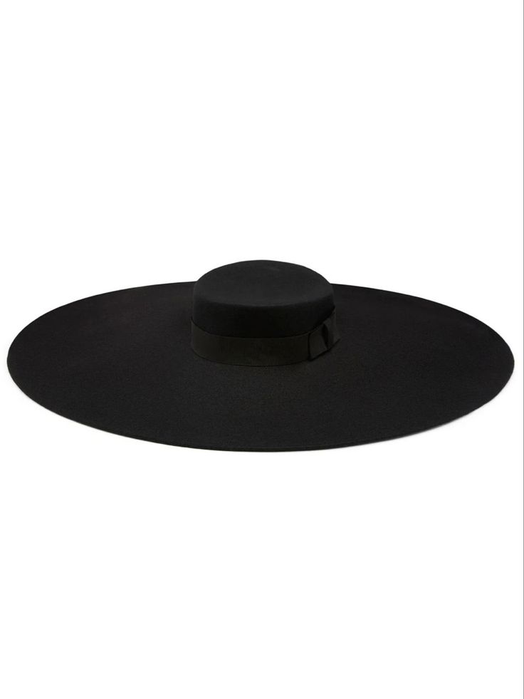 a black fedora with a wide brim, lying flat on a white background. the hat is made of felt and has a simple design.