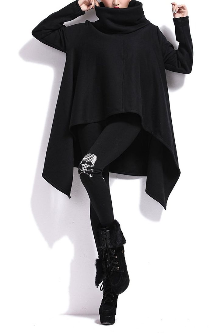 a person is wearing a black turtleneck sweater with an asymmetrical hemline, black leggings with a skull design on the knee, and black boots. the overall style is gothic fashion.