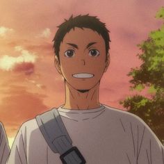 the image shows a young man with short brown hair and brown eyes. he is wearing a white tshirt and has a gray bag slung over his shoulder. he is smiling happily. the background is a warm orange and yellow, suggesting a sunset. the overall impression is one of warmth and happiness.