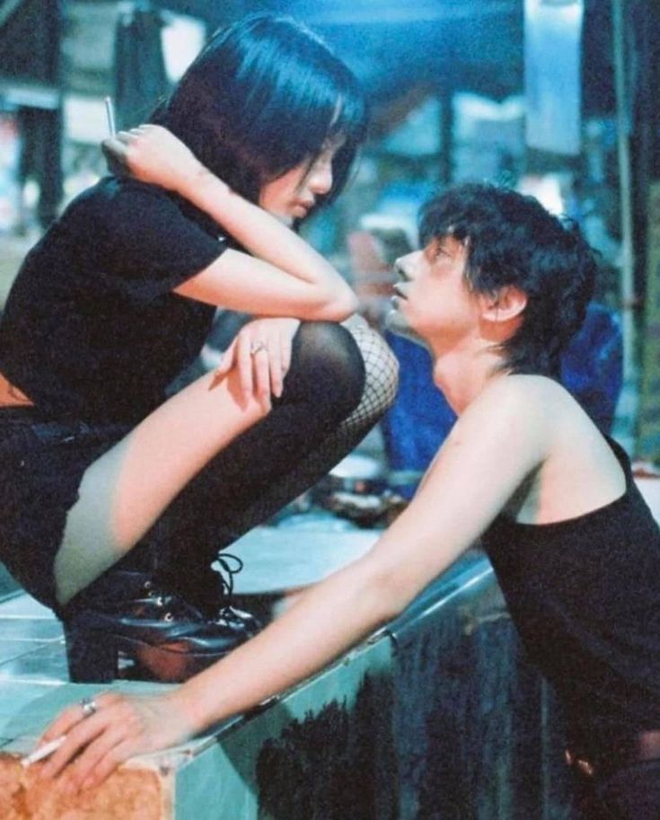 a man and woman look deeply into each other