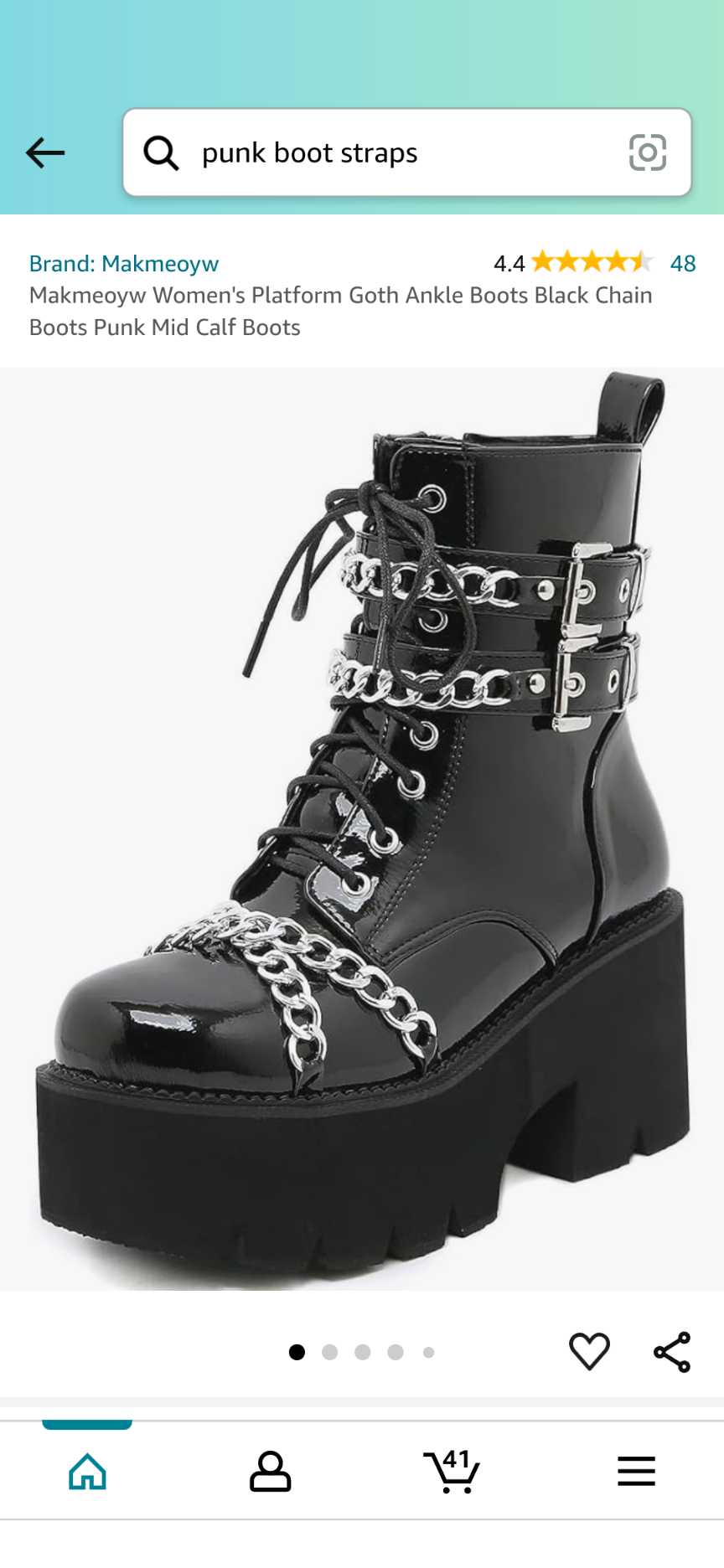 a closeup shot of a pair of black platform goth ankle boots. the boots feature a black leather upper, a chunky platform sole, and a silver chain detail. the boots are laced up the front and have a buckle strap at the ankle.