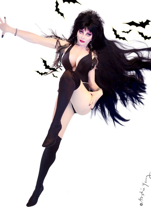 a woman in a black costume with long