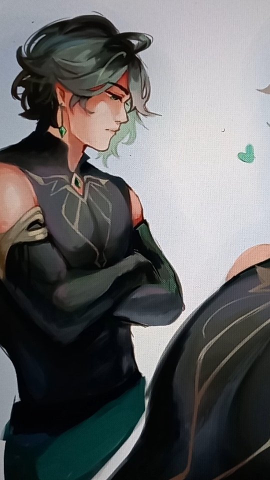 the image is a digital fanart depicting a stylized animestyle male character. he has shoulderlength dark green hair, is wearing a dark, elegant outfit with hints of gold detailing and teal accents. his expression is serious and he stands with his arms folded across his chest.  he has a jadecolored earring visible. only a portion of a second person is visible in the background, partially obscuring the main character’s lower body. the background is a light gray with abstract elements, subtly hinting at a possible scene or setting. the overall style is smooth and painterly, with soft blending of colors and shading.