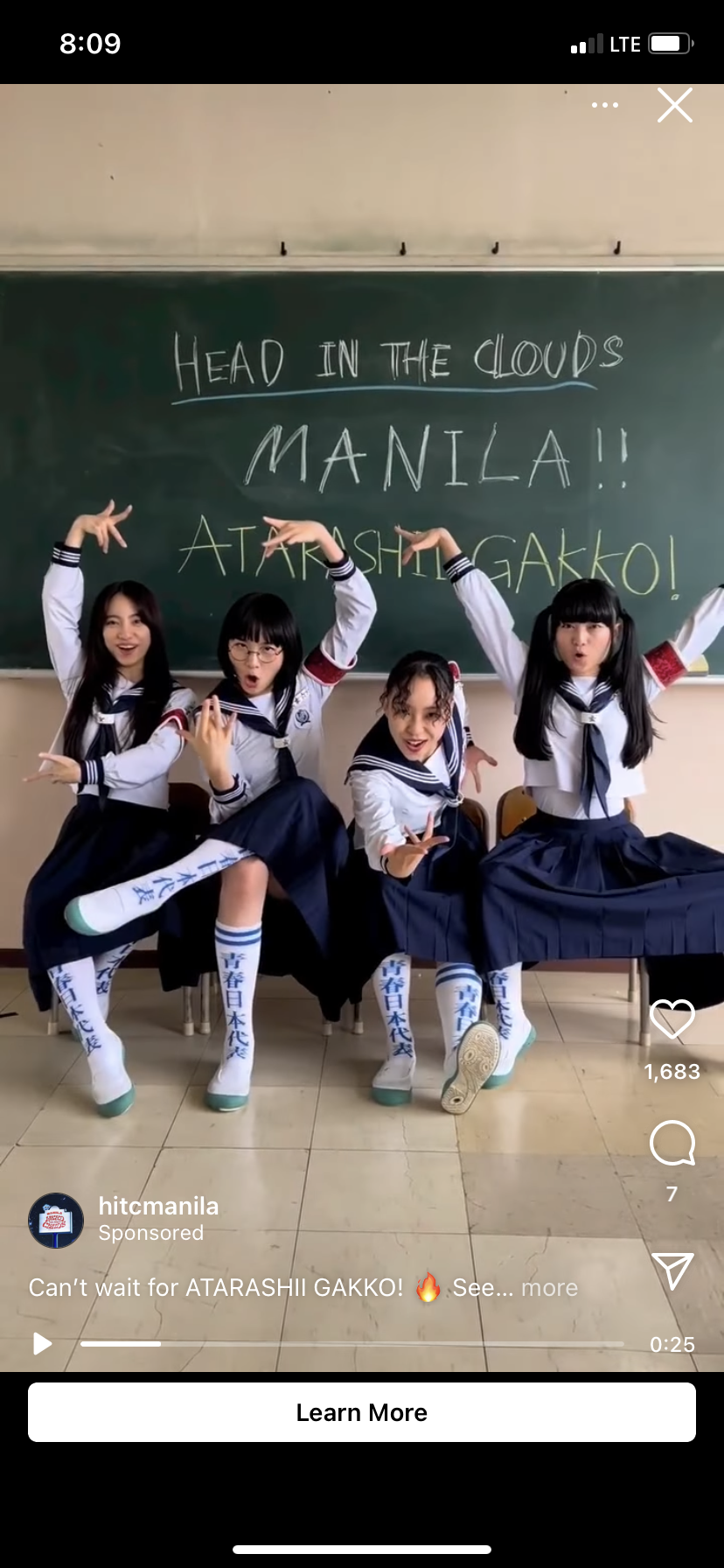 an instagram story promoting the band atarashii gakko! at head in the clouds manila music festival. the image features 4 girls dressed in japanese school uniform posing in front of a chalkboard that reads "head in the clouds manila!! atarashii gakko!".  there's also a "learn more" button at the bottom of the image.