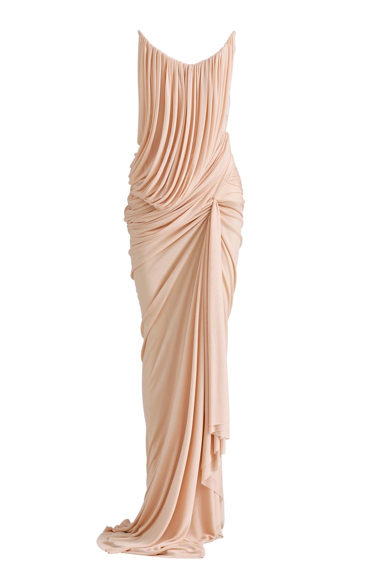 a fulllength peachcolored dress with a draped and gathered bodice and skirt. the dress is sleeveless and has a simple, minimalist design. it would be perfect for a formal occasion such as a wedding, gala, or blacktie event.