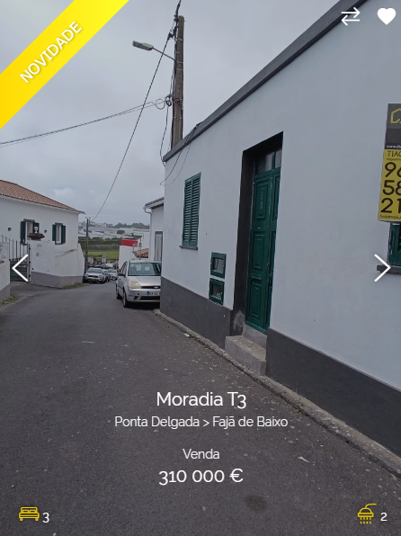 a photo of a house for sale in ponta delgada, portugal. the house is white with a green door and windows. the price is listed as 310,000 euros. there is a car parked in front of the house and a street sign indicating "novidade" which translates to "new" in english. the house is part of a neighborhood with a variety of other houses nearby.