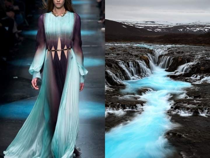 the image is a split image. the left side features a fashion model wearing a flowing, turquoise gown with a black underskirt and a gold belt. the model is walking on a runway with a blue background. the right side features a stunning waterfall cascading down a rocky landscape in iceland. the water is a vibrant turquoise color, creating a striking contrast with the black rocks. the images are juxtaposed to highlight the beauty and flow of both fashion and nature.
