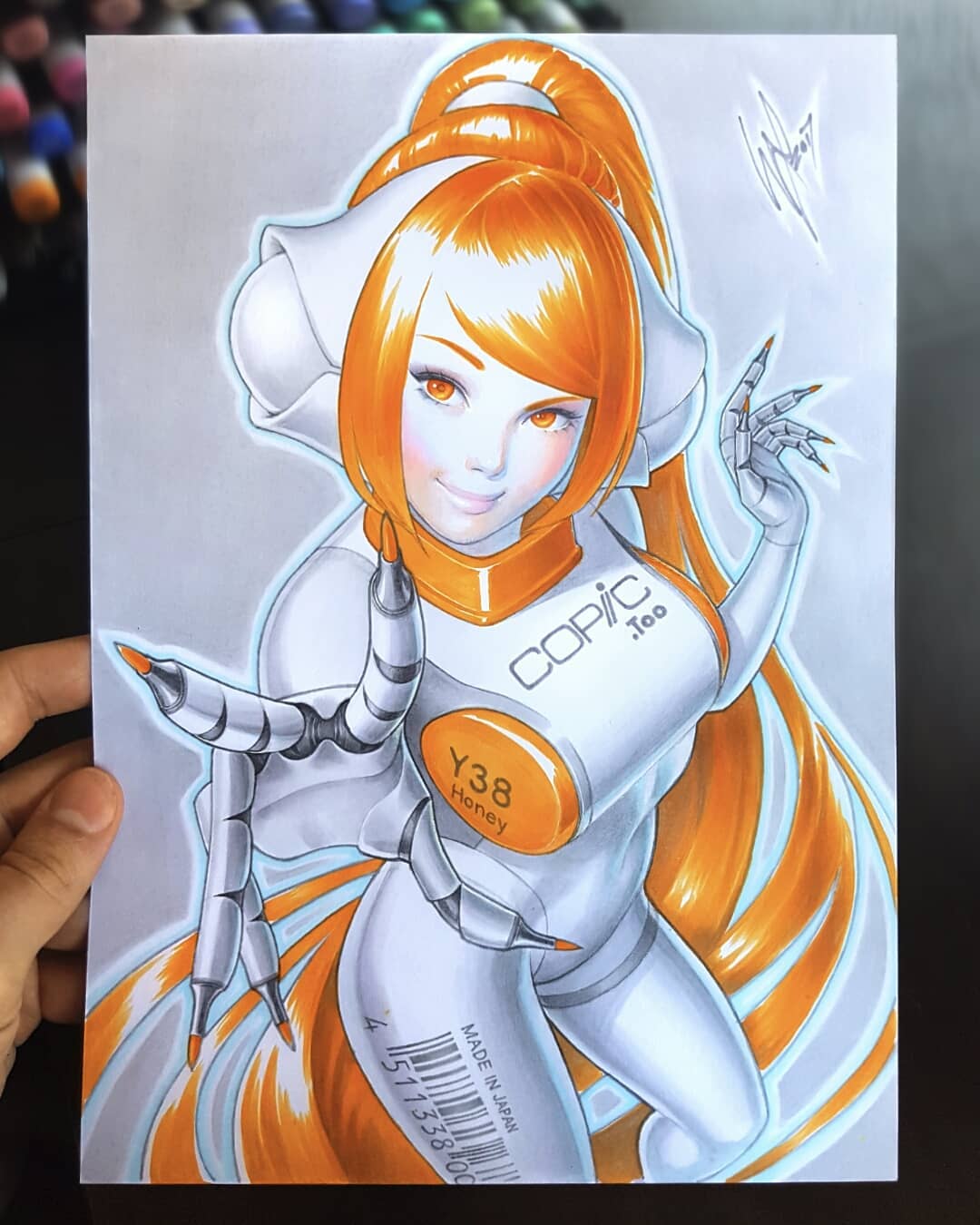 this is a colorful anime style illustration of a female cyborg wearing a white and orange suit. the image is drawn with copic markers on paper, with the copic y38 "honey" marker visible. the cyborg has long orange hair tied back in a ponytail, large orange eyes, and a friendly, smiling expression. she is standing with one hand raised in a pointing gesture. the image is a vibrant and detailed depiction of a futuristic character.