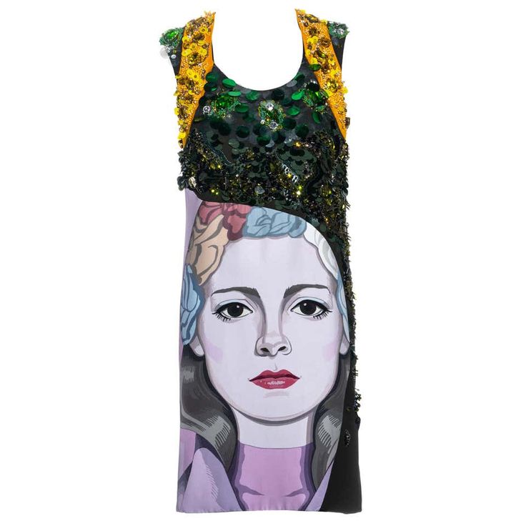 a sleeveless sequined black and green dress, adorned with yellow straps.  the bodice of the dress features a unique design where the top half of the dress is a black, green and yellow sequined fabric. the bottom half is a portrait of a woman with a floral headband. the dress is elegant and stylish, and perfect for a formal event.