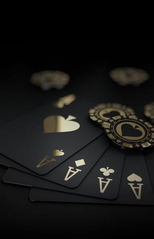 the image showcases a fannedout hand of black playing cards, all aces, with several gold poker chips resting on top. the scene is set against a dark background, highlighting the gold accents on the cards and chips.
