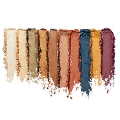 a closeup image of a colorful eyeshadow palette showing a mix of warm and cool shades. the palette includes various browns, oranges, reds, purples, and blues. each shade has a unique texture, ranging from matte to shimmer, offering a wide range of options for eye makeup looks.