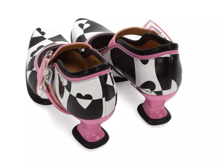 a pair of black and white checkered shoes with a pink heel and black and white heart pattern. the shoes are on a white background.