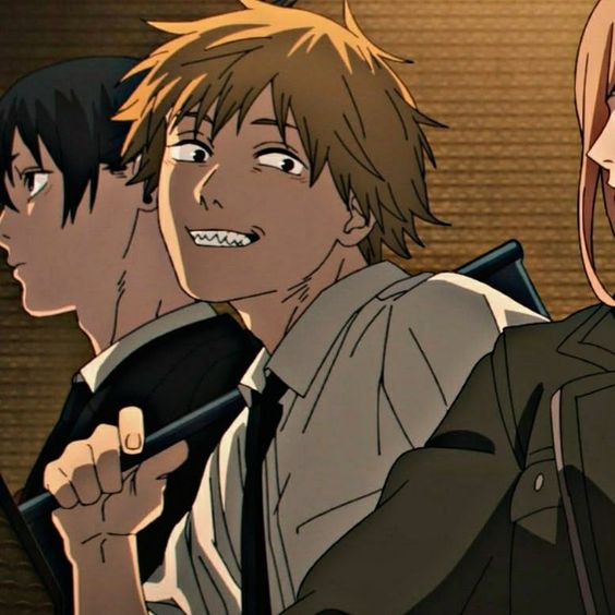 this image shows a digital illustration of three characters from the chainsaw man anime. in the foreground is denji, a young man with short blond hair and a menacing grin, his eyes wide and intense. he's wearing a white dress shirt and dark tie. he holds a black object in his right hand, partially obscured by the shadows. behind him to the left is aki hayakawa, another young man with dark hair and a stoic expression. he wears a black suit and tie.  on the right side of the image, a portion of a third character, power, is visible. she has long, flowing pink hair and is wearing a dark jacket. the background is a warm brown, and the overall lighting is soft, casting the characters' features in a mix of light and shadow.