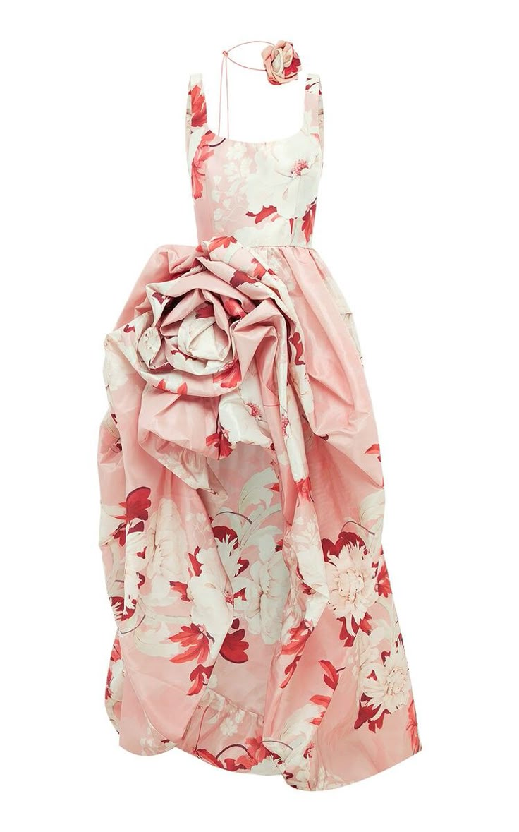 a long, sleeveless floral print dress with a large rose detail near the waist and a matching floral headband.