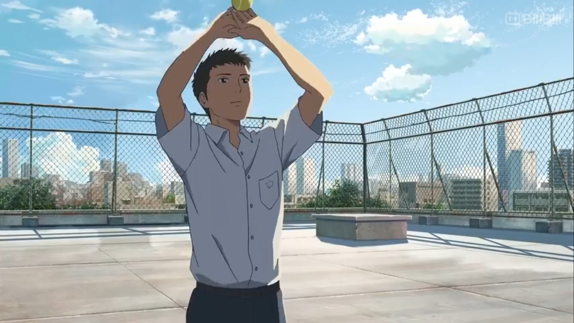 an anime character with short brown hair wearing a light blue, shortsleeved, collared shirt and black pants stands on a rooftop. the character is facing away from the viewer and appears to be tossing a small, indistinct green object into the air. the scene is set against a backdrop of a blue sky with scattered clouds, and a cityscape with tall buildings can be seen in the distance. the overall lighting suggests a bright, sunny day.