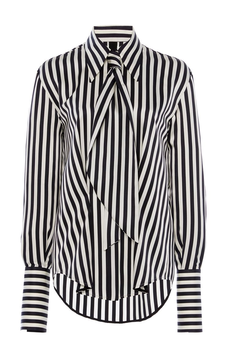 a longsleeved, buttondown blouse with black and white stripes and a pussy bow tie.