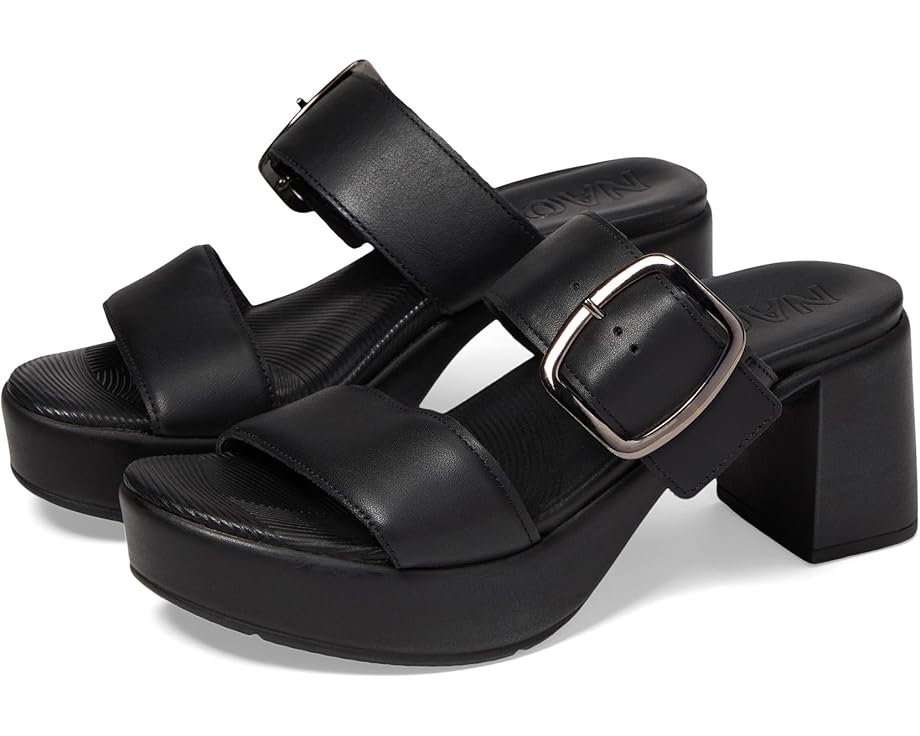 a pair of black leather platform sandals with a buckle on the strap. the sandals have a thick platform sole and a block heel. the sandals are perfect for summer and can be dressed up or down.