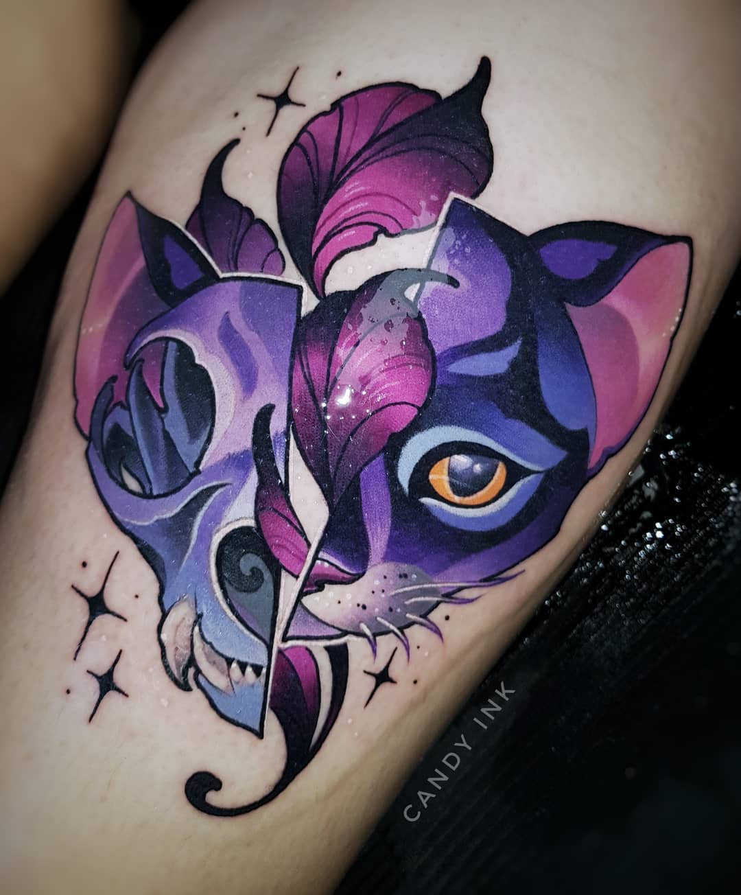 a neotraditional tattoo of a cat skull morphing into a cat face. the art style is colorful and cartoonish. half of the image is a cat skull and the other half is a cat's face. the colors are mostly shades of purple and pink. there are also some white highlights.