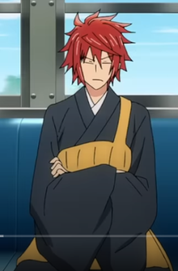 an anime character with red hair, wearing a black robe with a yellow sash, is sitting on a bus seat. the character is frowning and looks bored.