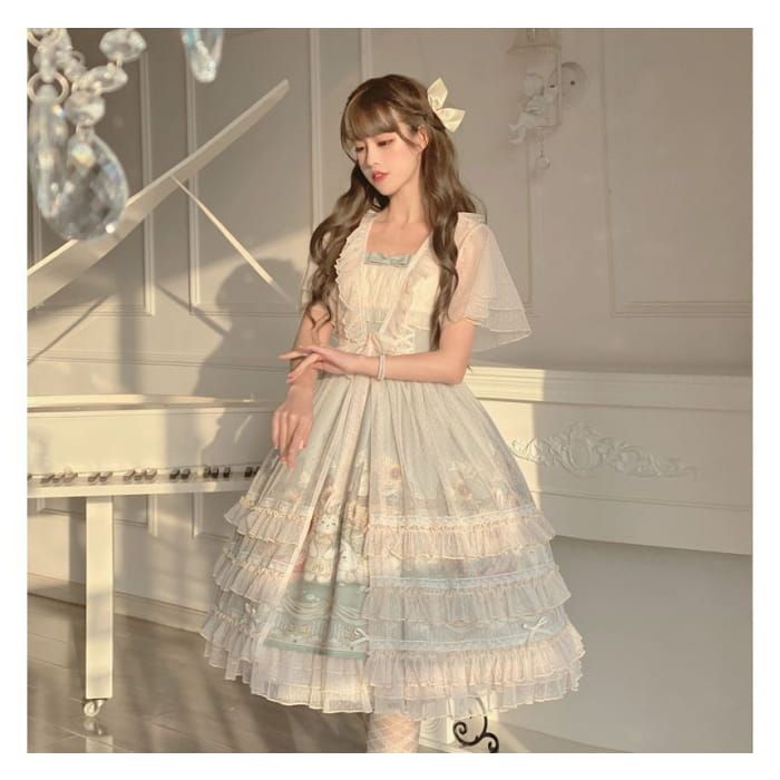 a young woman is posing in a beautiful lolita style dress. she is indoors, standing in front of a white piano with intricate carvings.  she has long brown hair with a bow and is wearing a delicate, flowing dress with layers of fabric and lace. the dress is light blue and white with a natureinspired print. the image is brightly lit and the woman is the focal point.  the overall feel is elegant and feminine.