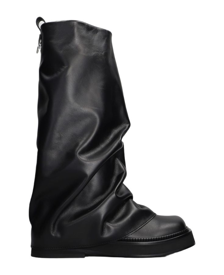 a pair of black leather slouch boots with a chunky heel and a round toe. the boots are made of soft, supple leather and have a relaxed, slouchy fit. they are perfect for casual wear and can be dressed up or down.
