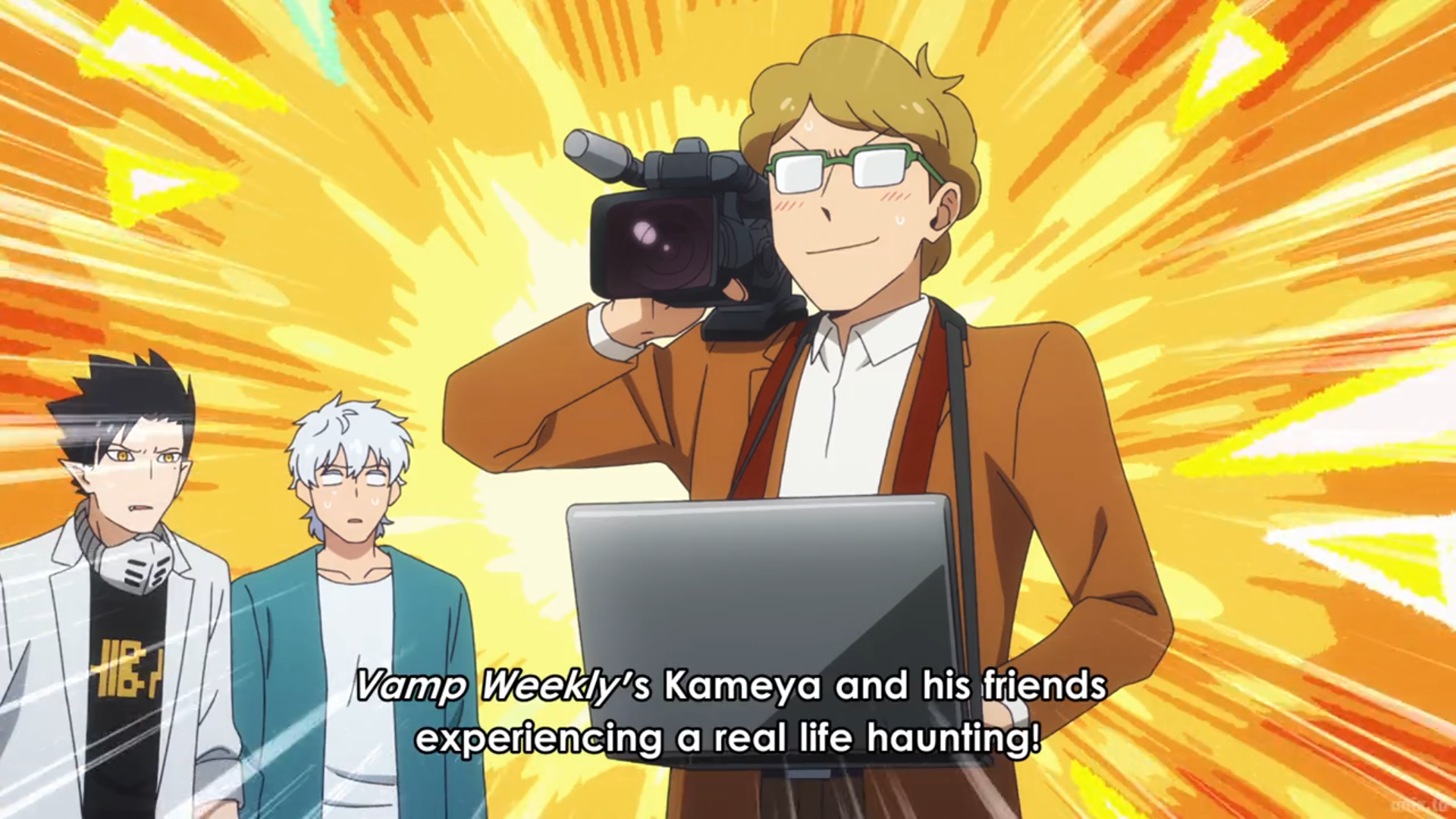 the image is a vibrant anime screenshot. a man with glasses and light brown hair, wearing a brown jacket and white shirt, dominates the foreground. he grins while holding a large, professional video camera. behind him, two other characters with white hair and black hair stand slightly out of focus. they appear surprised or intrigued. the background explodes with bright yellow and orange starburst patterns, conveying excitement or chaos. a caption at the bottom reads: "vamp weekly's kameya and his friends experiencing a reallife haunting!" this suggests the characters are involved in a paranormal investigation, possibly for a fictional publication.