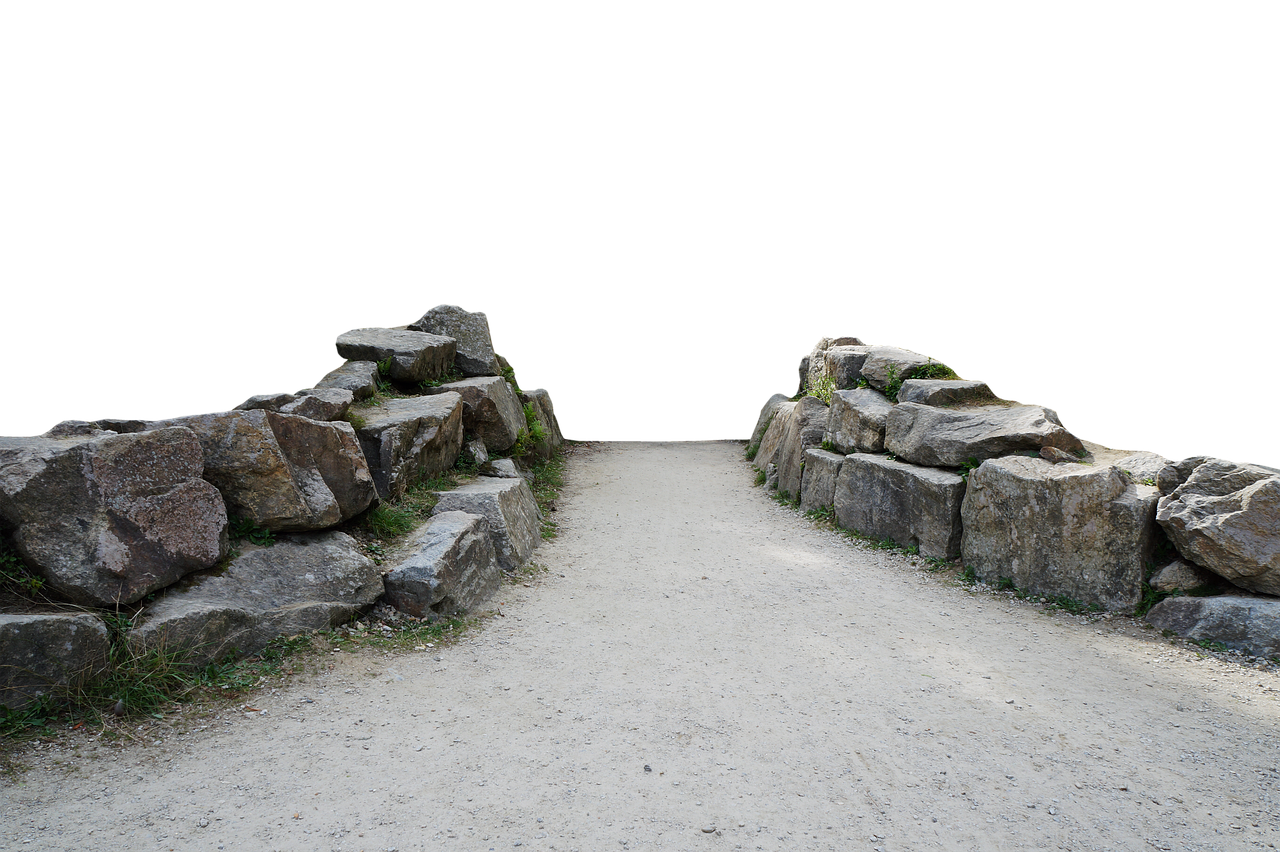 a dirt path leads through two rock walls on a black background. the path is made of lightcolored dirt and appears to be wellworn. the rock walls are constructed of various sizes of rocks and stones, with some grass and moss growing on them. the background is completely black, which highlights the path and rock walls.