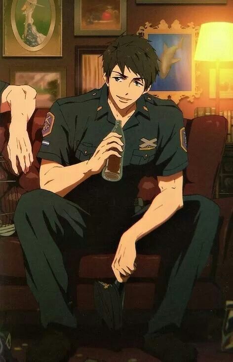 an anime man with dark hair and blue eyes sits on a couch, holding a bottle in one hand. he is wearing a dark green uniform with patches on the sleeves, suggesting he may be a police officer. he appears to be off duty and relaxing, with a pleasant smile on his face. the setting is indoors, likely a home, with warm lighting coming from a lamp. the image has a relaxed and inviting atmosphere.