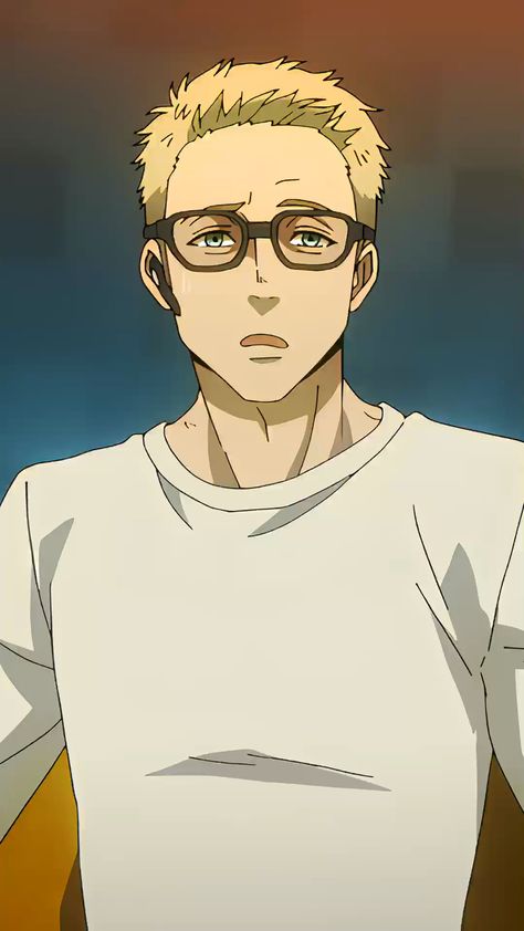 the image shows the upper body of a young man with a concerned expression. he has short blond hair and is wearing round glasses. he's wearing a simple white tshirt and the background is a blurry mix of orange and blue.