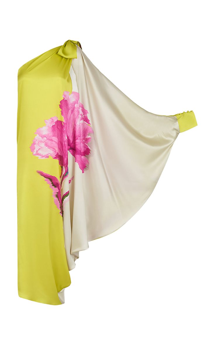 the image shows a women's oneshoulder dress. the dress is predominantly lime green on one side and features a large, pink floral print. the other half of the dress is a flowing beige silk cape. the dress has a long, asymmetrical hem and a long sleeve on one side. the fabric looks luxurious and silky. the overall style is elegant and stylish.