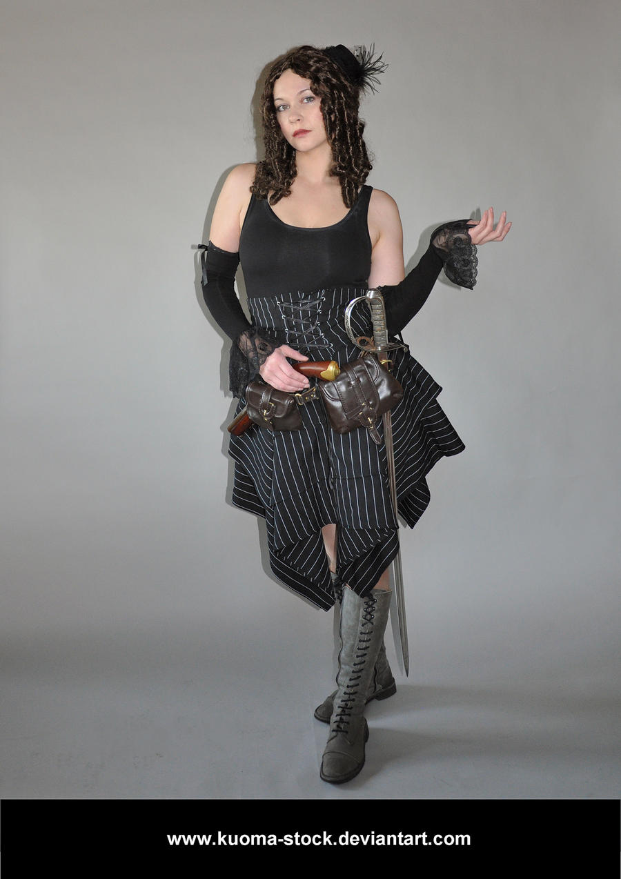 the image shows a woman in a steampunkinspired costume. she has long, dark curly hair, and is wearing a black corset top, pinstripe skirt, long gray gloves with lace detailing, and tall gray laced boots.  she carries a sword and a pistol in holsters attached to her skirt. the background is plain gray, making the costume the focal point.  her expression is serious. the overall style is dark and dramatic. the photo is credited to "kuomastock.deviantart.com".