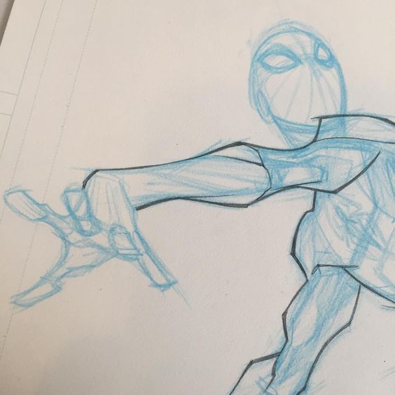 a blue pencil sketch of a superhero's hand outstretched, as if reaching for something. the sketch is on a white background and shows details of the anatomy of the arm and hand.  the superhero's head and torso are also visible, but not fully drawn. the pose is dynamic and conveys a sense of action.