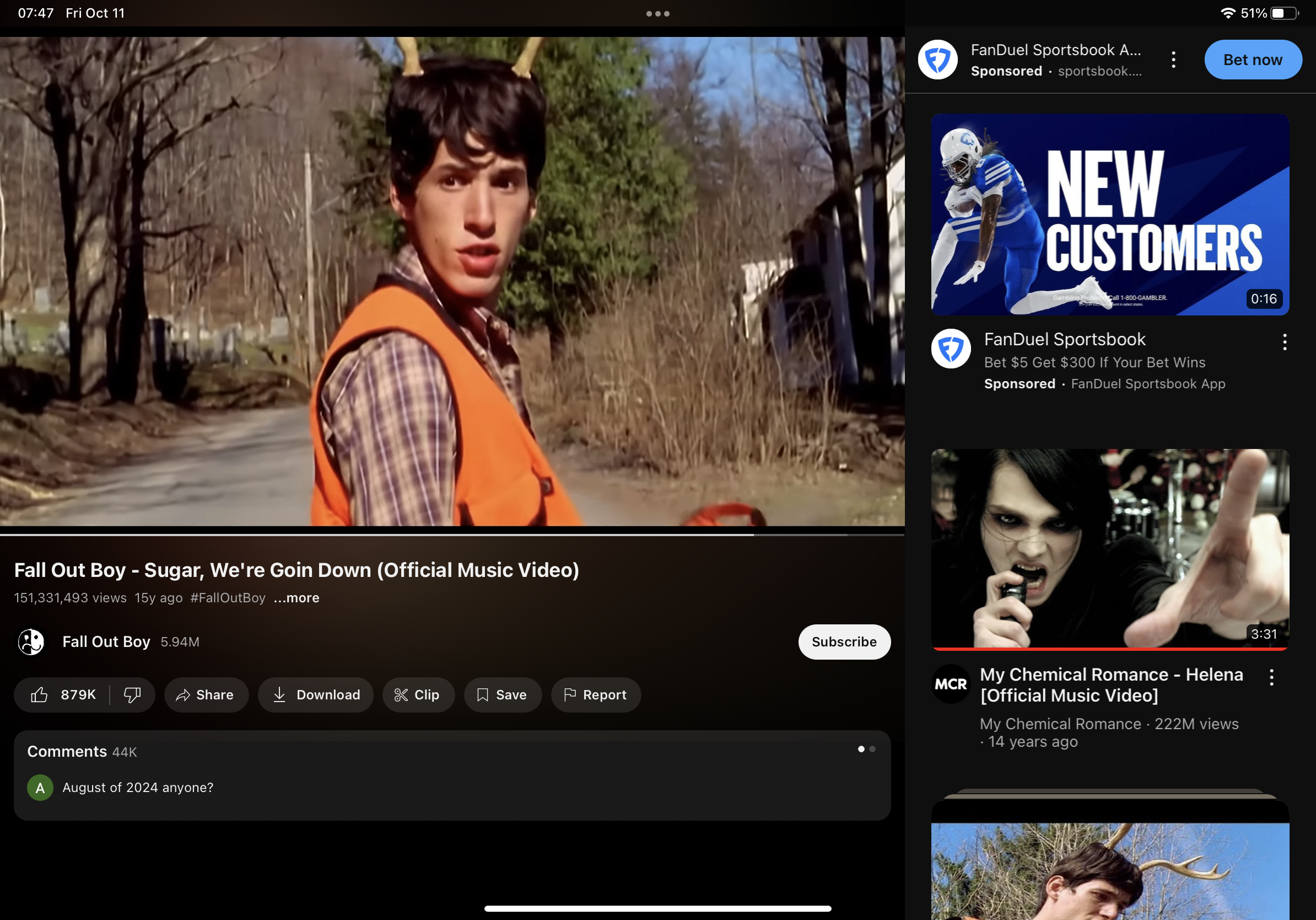 the image shows a screenshot of youtube with two different music videos playing. the video on the left is of fall out boy's song sugar, we're goin down and the one on the right is of my chemical romance's helena. the video on the right is currently paused.  the thumbnail for sugar, we're goin down shows a young man with antlers on his head. he is wearing a plaid shirt and a bright orange vest.  the thumbnail for helena shows a man in black clothing singing into a microphone.  the image also shows ads for fanduel sportsbook on the right side of the screen.