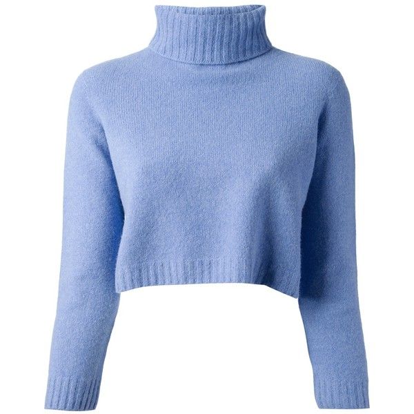 a closeup of a women's blue cropped turtleneck sweater. the sweater is made of a soft knit fabric and has long sleeves. it is a casual and comfy style that is perfect for winter. the sweater is shown on a white background.