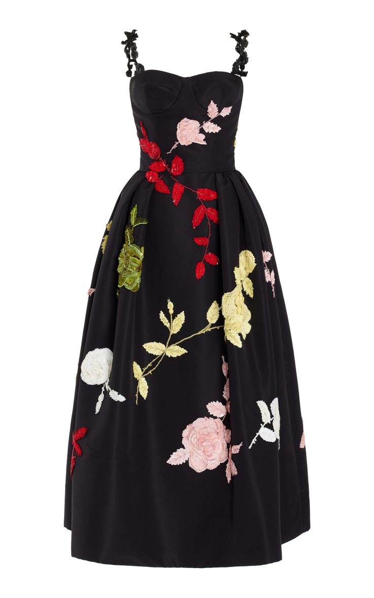 this is a black embroidered gown with a strapless neckline. the gown is adorned with floral embroidery, with the flowers varying in shades of red, pink, green, and yellow. the skirt of the gown is full and flowing, and the dress is perfect for a formal event or a special occasion.