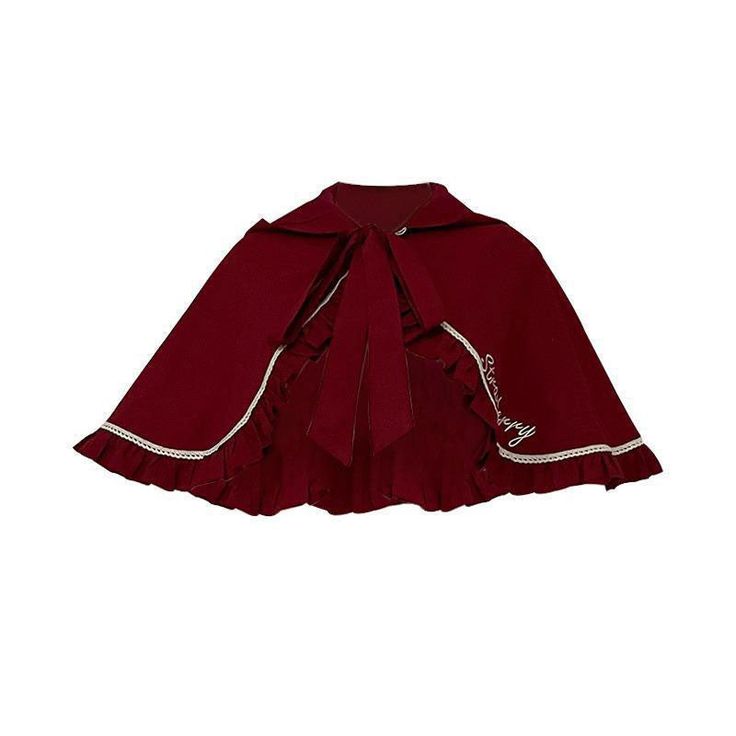 a closeup view of a deep red lolita fashion cape with a ruffled hem, a collar, and a tie closure at the neck.  the cape has a cursive embroidered design on the front.