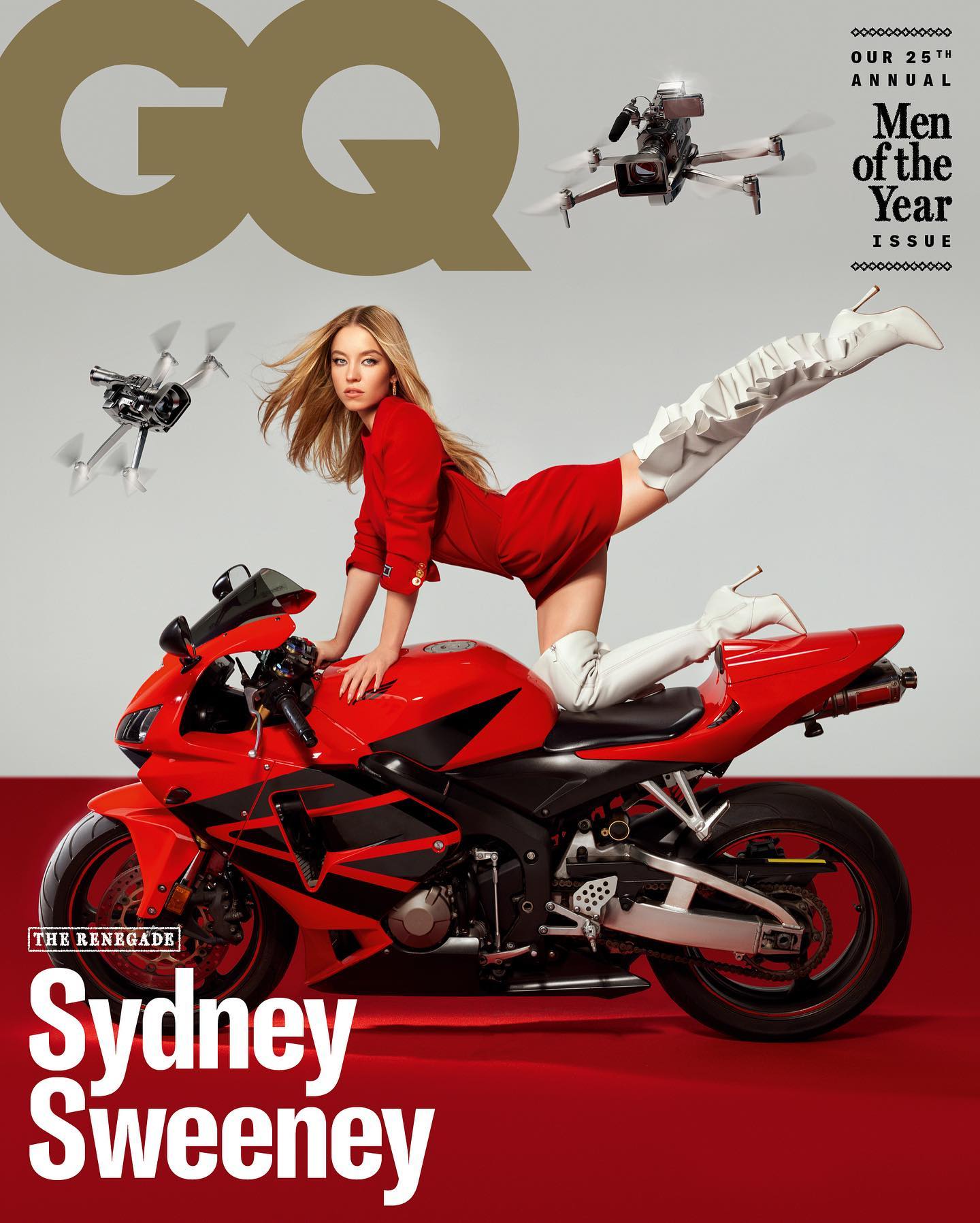 this is the cover of gq magazine's 25th annual men of the year issue, featuring actress sydney sweeney.  sweeney is depicted sitting on a red honda cbr motorcycle, wearing a red dress and white high boots.  two drones are visible in the background. the overall style is glamorous and fashionable. the cover text clearly indicates the magazine's title, the issue's theme ("men of the year"), and the featured person.