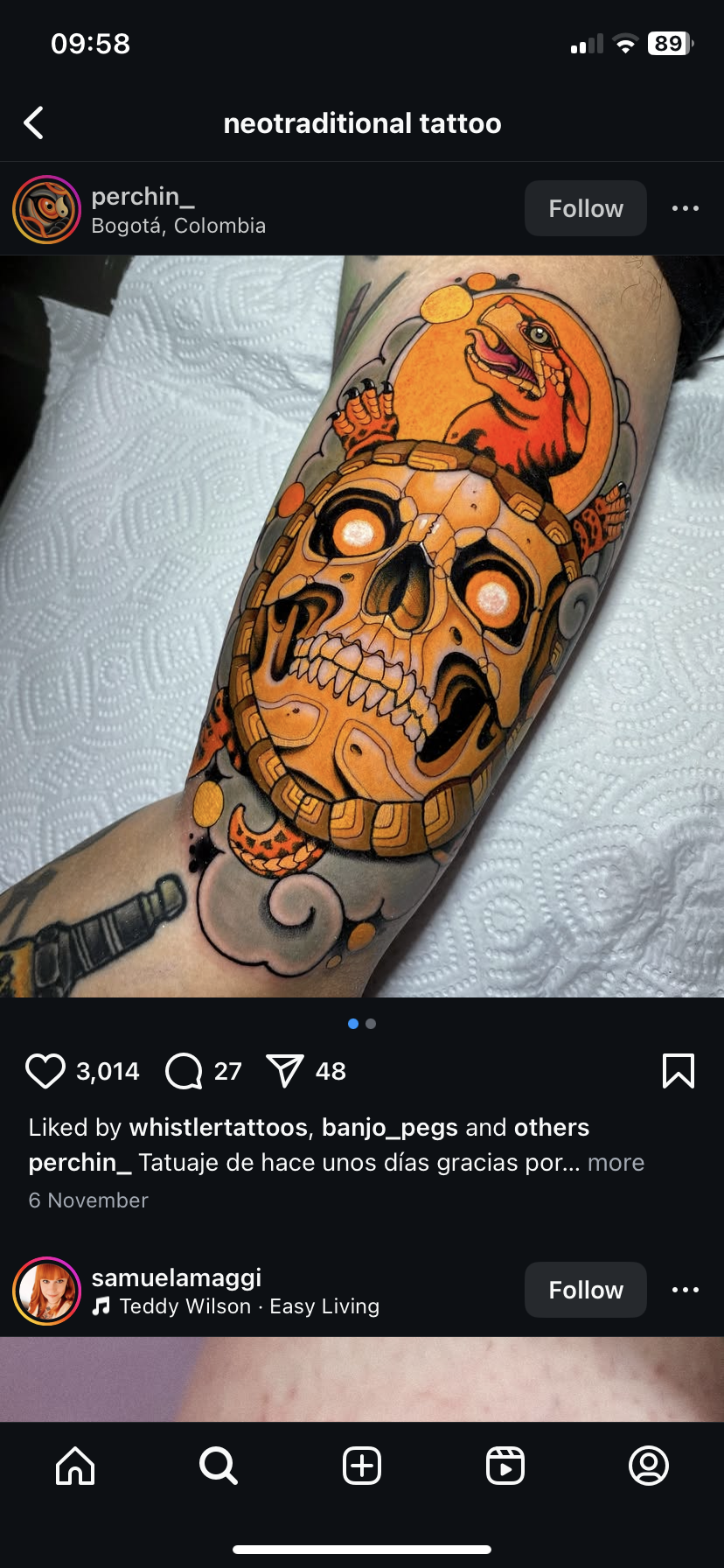 the image is a closeup photograph of a neotraditional style tattoo on someone's arm. the tattoo features a stylized skull in a circular frame, encircled by what appears to be a stylized reptile or dragon, and detailed with geometric and floral designs, set against a predominantly orange and black color palette. the tattoo's style is heavily influenced by japanese and aztec motifs. the image is sourced from an instagram post from the artist "perchin_", located in bogotá, colombia. the post shows the tattoo, the artist's information, likes, and comments.  there are also details on the phone's screen showing time, signal strength, and instagram navigation controls.