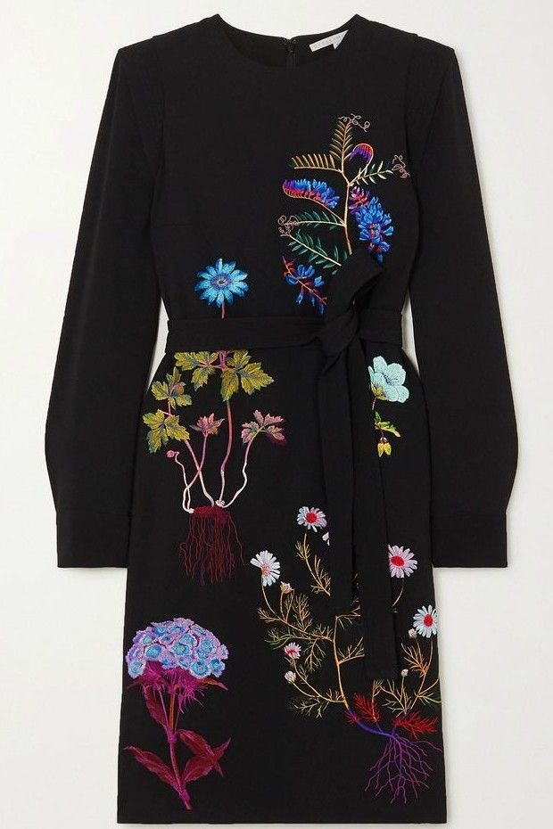 a black, kneelength dress with long sleeves and floral embroidery. the dress features a tie waist and various embroidered floral designs in shades of blue, purple, red, and green.