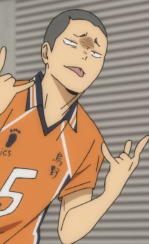 an anime character wearing an orange volleyball jersey with the number 5 on the front, is making a gesture with his fingers and smiling happily.  he is looking to the left of the frame. the background is a grey wall with white stripes.