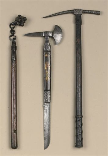 the image shows three different polearms against a plain background. from left to right: a mace with a flanged head on a chain, an axe with a folding knife incorporated into the shaft, and a pickaxe or war hammer.