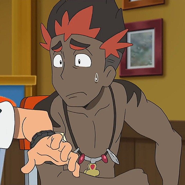 a close up of a worried pokemon character who appears to be sad. the character is male, and his face is an expression of sadness, worry, and possible fear. he has sweat droplets coming from his brow and forehead. the character has red and brown hair, brown skin and a golden necklace with a small pendant around his neck.  there are a few hints of a wooden background behind the character, and the character is looking down and to the right.