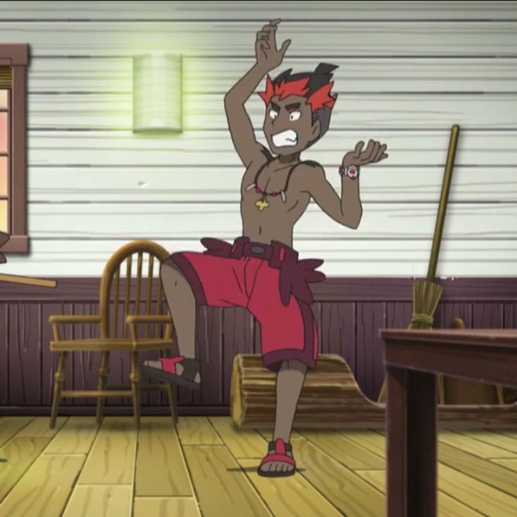 an anime character from the pokemon series is standing with his arms raised in the air, looking angry. he's wearing red shorts and has brown skin and a brown necklace. he is standing in a room with a wooden floor and two chairs, with a log behind him.  there is also a broom in the background.