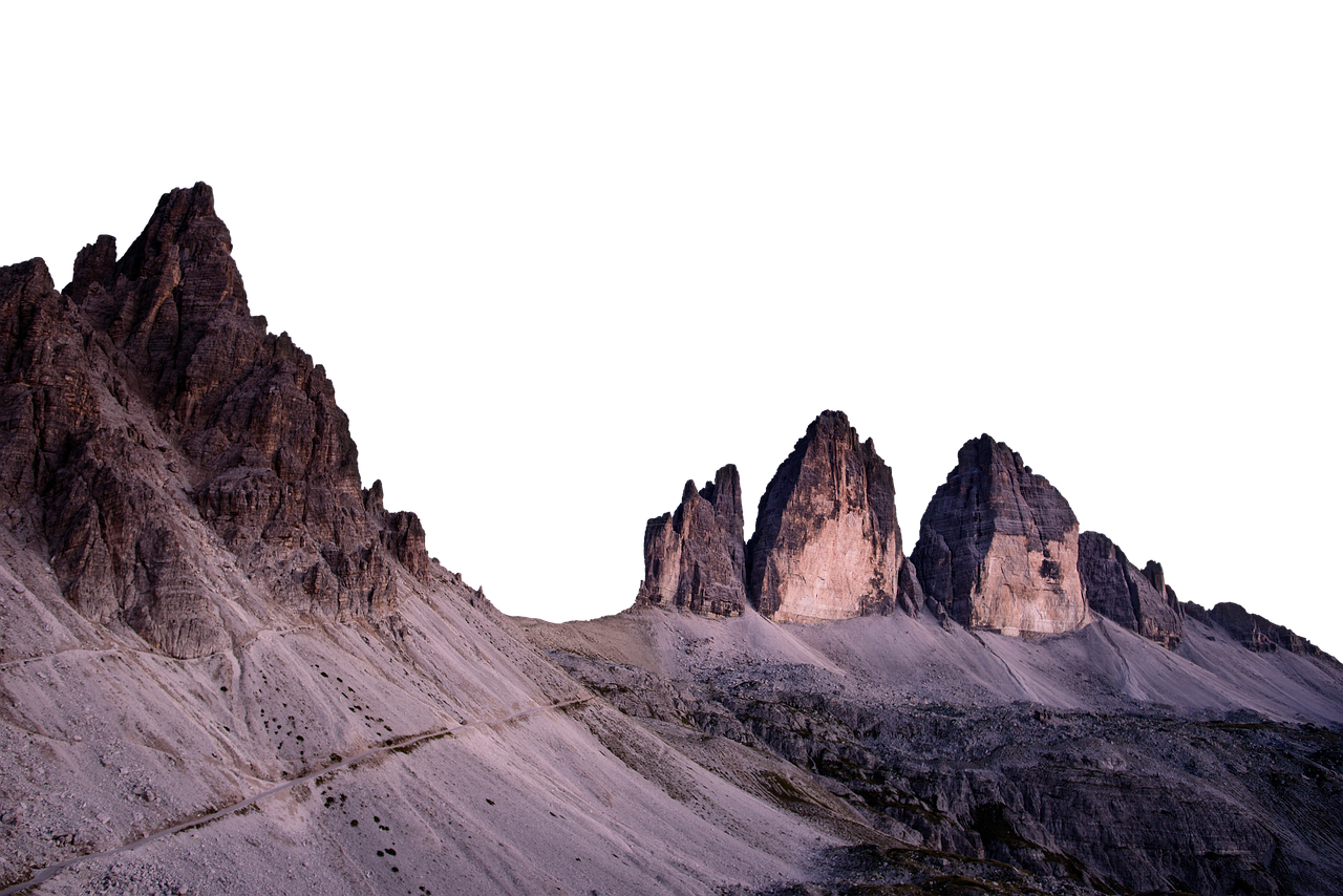 the image depicts the tre cime di lavaredo mountain range in the dolomites, italy, under a dark or twilight sky. the dramatic rock formations stand out with distinct peaks and steep cliffs. a path or trail is visible along the mountainside. the overall scene evokes a sense of ruggedness and natural beauty.