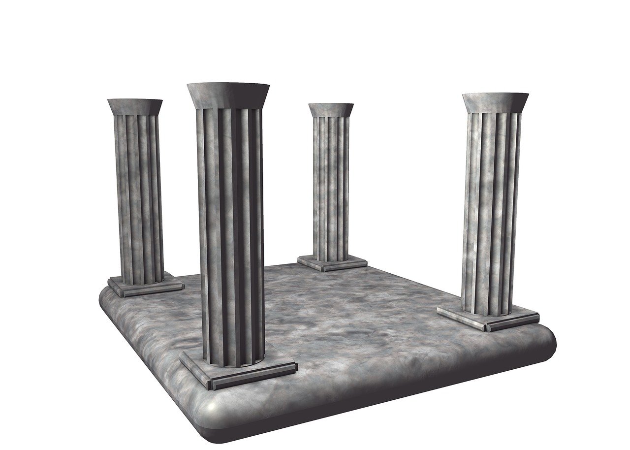 the image shows a grey stone platform with four grey marble columns placed at each corner. the platform appears to be made of marble, with a textured surface. the columns are fluted and have simple bases and capitals. the background is plain white, and the overall impression is of an ancient architectural ruin or a ceremonial platform.