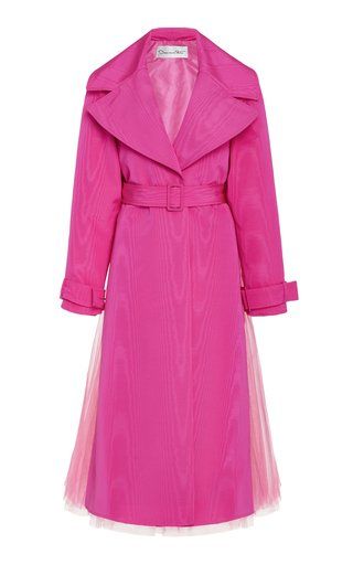 a pink trench coat with a belt and tulle underskirt is displayed on a white background.